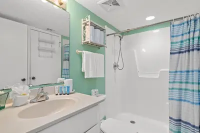a bathroom with a sink and a shower at Commodore 0607 in Panama City Beach