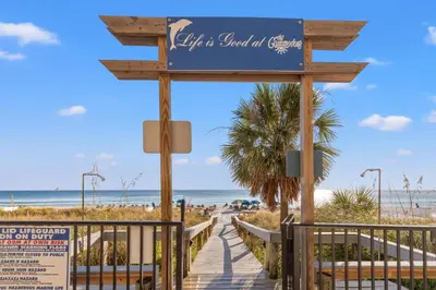 a boardwalk to the beach at a resort at Commodore 0607 in Panama City Beach