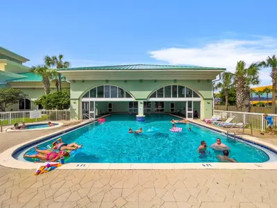 a group of people swimming in a swimming pool at Celadon #0606 in Panama City Beach