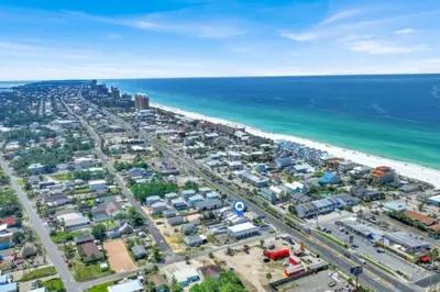 an aerial view of a beach and the ocean at Salty Soul in Panama City Beach
