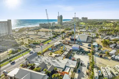 an aerial view of a city with the ocean at Salty Soul in Panama City Beach