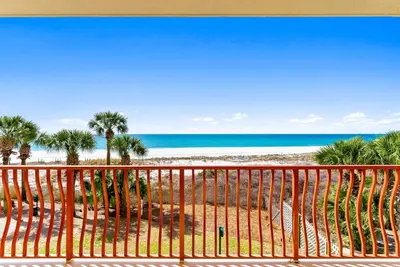 a view of the beach from a balcony at Hidden Dunes #201 in Panama City Beach