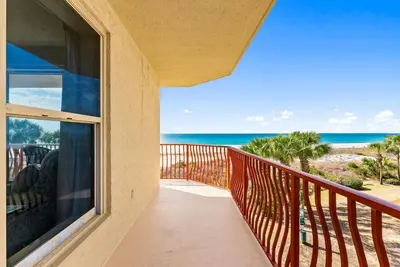 a balcony with a view of the ocean at Hidden Dunes #201 in Panama City Beach