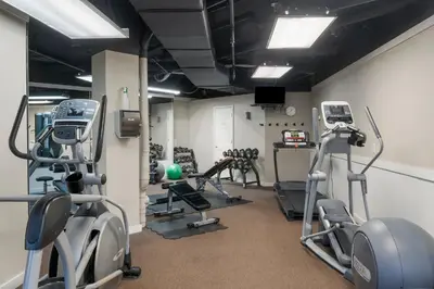 a gym with several treadmills and cardio machines at Hidden Dunes #201 in Panama City Beach