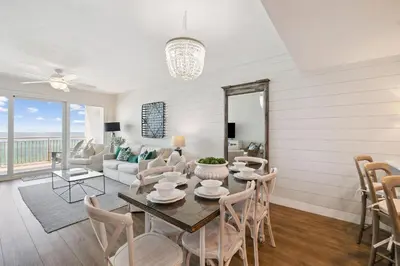 a living room with a table and chairs at HP 34W On the Shore by 30A Escapes in Rosemary Beach