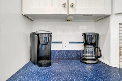 two blenders sitting on a counter in a kitchen at Seachase E301 by Emerald Coast Retreats in Panama City Beach