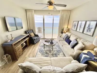 a living room with a couch and a table at Celadon 2005 by Emerald Coast Retreats in Panama City Beach