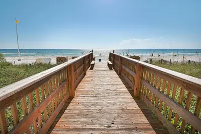 a wooden boardwalk leading to the beach at Celadon 2005 by Emerald Coast Retreats in Panama City Beach