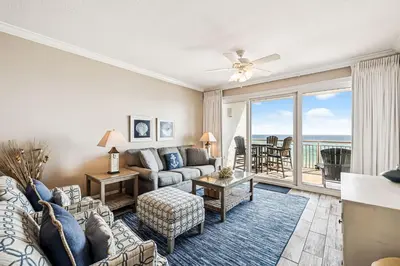 a living room with a couch and a table at HP 35W Gulf Front Condo by 30A Escapes in Rosemary Beach