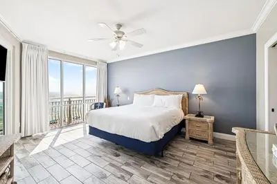a bedroom with a bed and a balcony at HP 35W Gulf Front Condo by 30A Escapes in Rosemary Beach