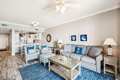 a living room with a couch and a table at HP 35W Gulf Front Condo by 30A Escapes in Rosemary Beach