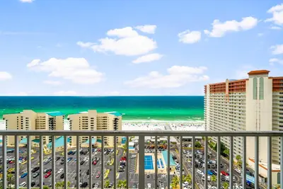 a view of the beach from the balcony of a resort at Laketown Wharf #1826 in Panama City Beach
