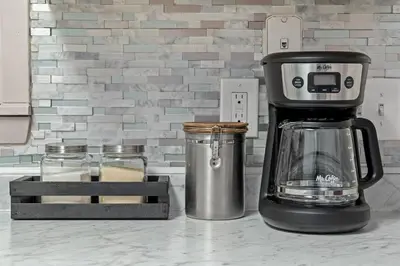 a coffee maker sitting on top of a counter at Bombastic Beach Bungalow, 10 Min WALK to the Beach in Panama City Beach