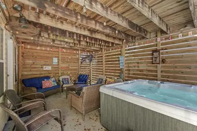 a room with a large hot tub in a house at Bombastic Beach Home, HOT TUB, 8min WALK to Beach in Panama City Beach