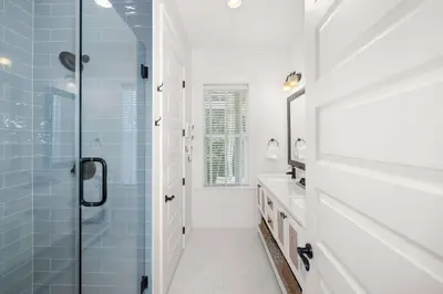 a bathroom with a shower and a sink at Seagrove Escape Refreshed plus Shared Pool in Seagrove Beach