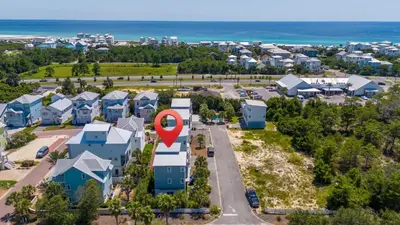 an aerial view of a suburb with a red marker on it at Inlet Beach Retreat Golf Cart Bikes + Pool in Inlet Beach