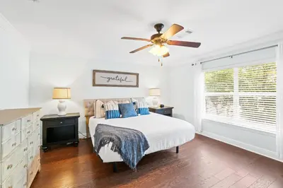 a bedroom with a bed and a ceiling fan at Family Friendly Vacation Rental at 30Ave Beach Retreat in Inlet Beach in Rosemary Beach