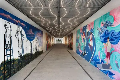 a hallway with colorful murals on the walls at Family Friendly Vacation Rental at 30Ave Beach Retreat in Inlet Beach in Rosemary Beach