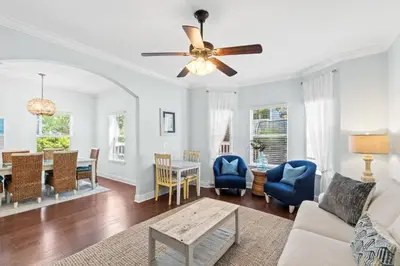a living room with a couch and a ceiling fan at Family Friendly Vacation Rental at 30Ave Beach Retreat in Inlet Beach in Rosemary Beach