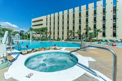 a hot tub in the middle of a swimming pool at Emerald Beach 1631 by Emerald Coast Retreats in Panama City Beach