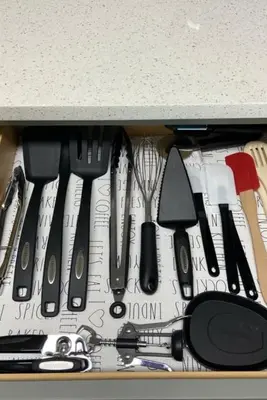 a drawer filled with knives and other kitchen utensils at Calypso III Stunning Oceanview next to Pier Park Mall in Panama City Beach