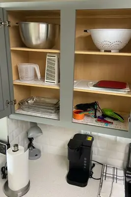 a kitchen cabinet filled with lots of kitchen utensils at Calypso III Stunning Oceanview next to Pier Park Mall in Panama City Beach