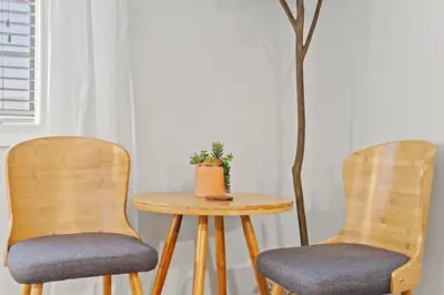 two chairs and a table with a plant on it at Village of SoWal B203 in Rosemary Beach