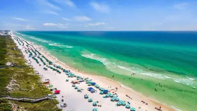 an aerial view of a beach with umbrellas and the ocean at Village of SoWal B257 in Rosemary Beach