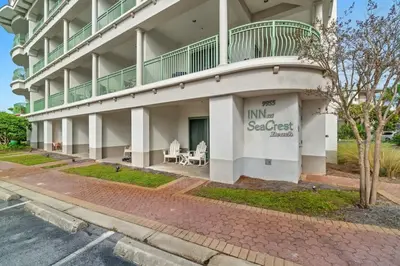 a building with a balcony on the side of it at Inn at Seacrest Beach 409 in Inlet Beach
