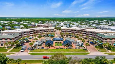 an aerial view of a building with a parking lot at Village of SoWal B483 in Rosemary Beach