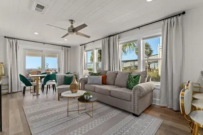 a living room with a couch and a table at 9620 Beach Blvd in Panama City Beach