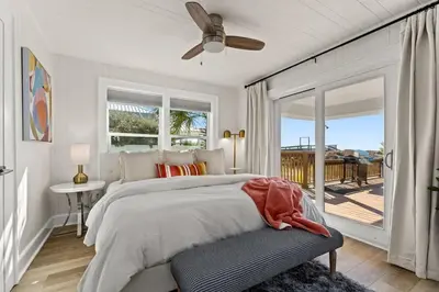 a bedroom with a bed and a ceiling fan at 9620 Beach Blvd in Panama City Beach