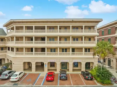 a large building with a balcony on top of it at Village of SoWal B204 in Rosemary Beach