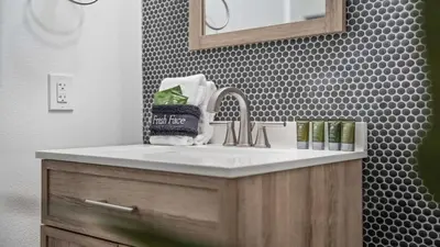 a bathroom with a sink and a mirror at Inn at Seacrest Beach 408 in Rosemary Beach