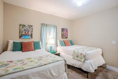 a bedroom with two beds and a window at Wharftown Retreat - 8ppl in Panama City Beach