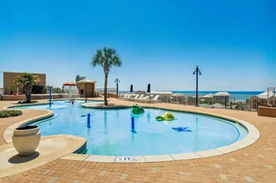 a large pool in the middle of a resort at Wharftown Retreat - 8ppl in Panama City Beach