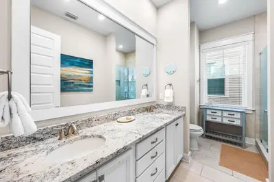 a bathroom with two sinks and a large mirror at Restfull Dwelling in Inlet Beach