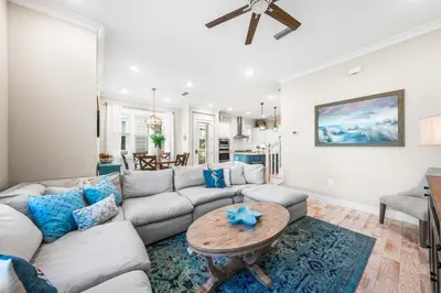 a living room with a couch and a table at Restfull Dwelling in Inlet Beach