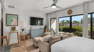a bedroom with a bed and a couch at Emerald Hill 23 - The Little Pearl in Santa Rosa Beach