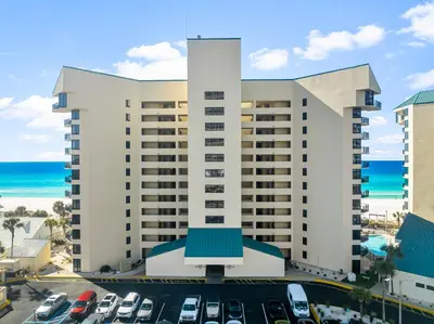 a view of the hotel from the parking lot at Sunbird of Panama City Beach 503E in Panama City Beach
