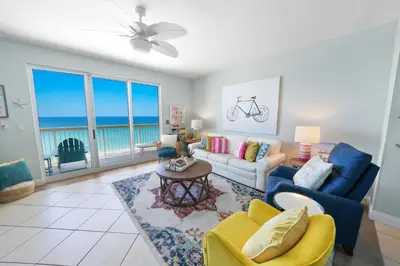 a living room with a view of the ocean at The Emerald Nest in Panama City Beach