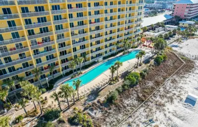 an aerial view of a large building and a swimming pool at The Emerald Nest in Panama City Beach