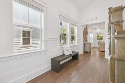 a white room with a bench and windows at Our Oasis in Inlet Beach