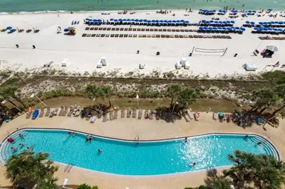 an overhead view of a pool and the beach at Calypso 1-202 by Emerald Coast Retreats in Panama City Beach
