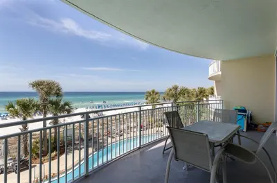a balcony with a view of the beach at Rare Corner-Unit at AQUA 201 Private Elevator, Multiple Balconies Sunset Views in Panama City Beach