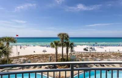 a view of the beach from the balcony of a resort at Rare Corner-Unit at AQUA 201 Private Elevator, Multiple Balconies Sunset Views in Panama City Beach