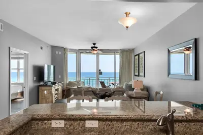 a living room with a view of the ocean at Aqua 0309 in Panama City Beach