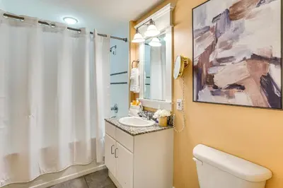 a bathroom with a white toilet and a sink at Scenic Balcony and Resort Perks PCB Condo! in Panama City Beach