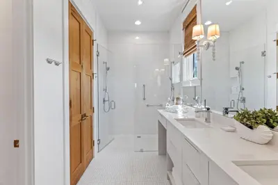 a white bathroom with a sink and a shower at Salt & Light in Santa Rosa Beach