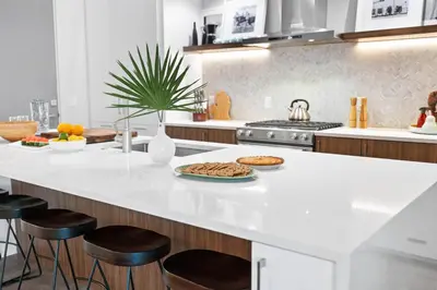 a kitchen with a counter with a plate of food on it at Seagrove Surf Shack in Santa Rosa Beach